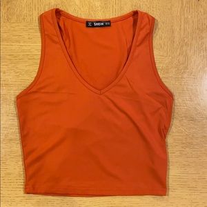 Dark orange V-neck tank top.